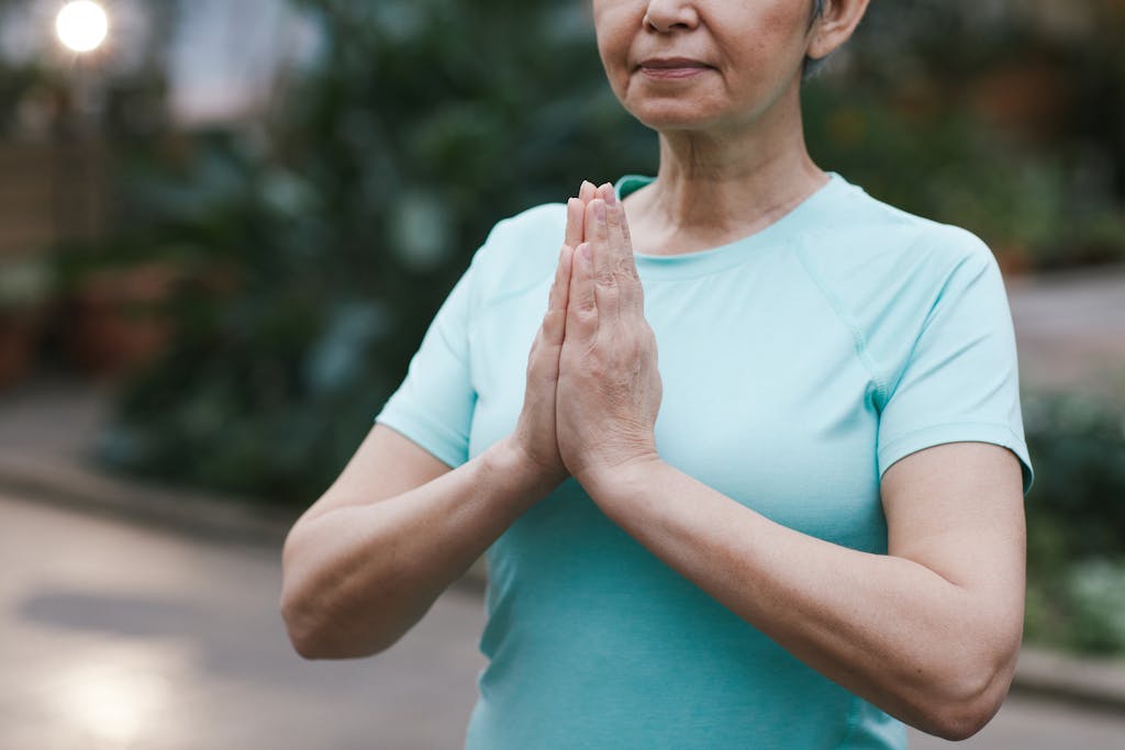 Woman Practicing Yoga Therapy, hands in mudra